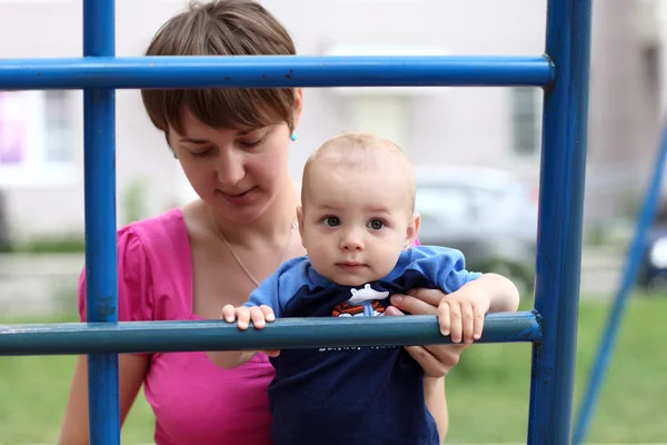 Baby on ladder — Stock Photo, Image