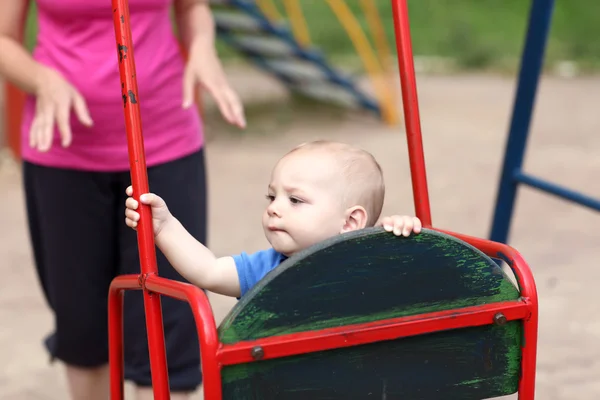 Child on swing — Stock Photo, Image