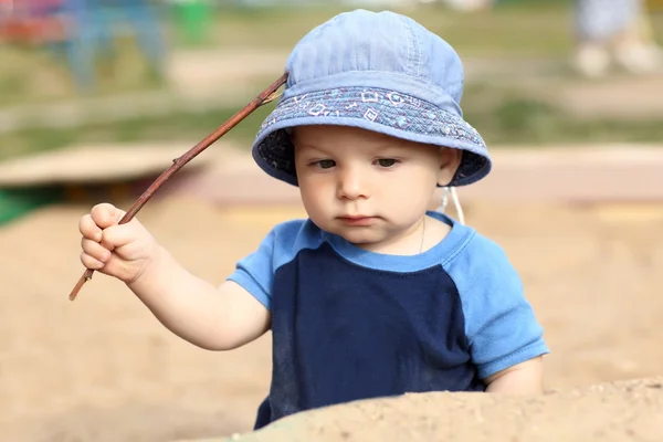 Child holding stick — Stock Photo, Image