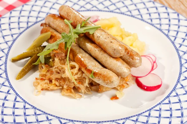 Sausages with cabbage — Stock Photo, Image