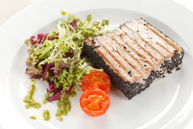 Salmon steak with salad clipart