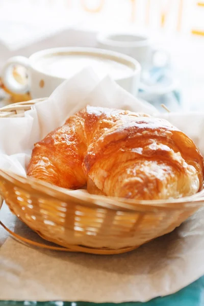 Croissant and a cup of coffee — Stock Photo, Image