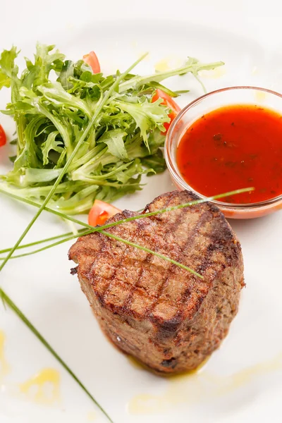 Grilled steak with sauce — Stock Photo, Image