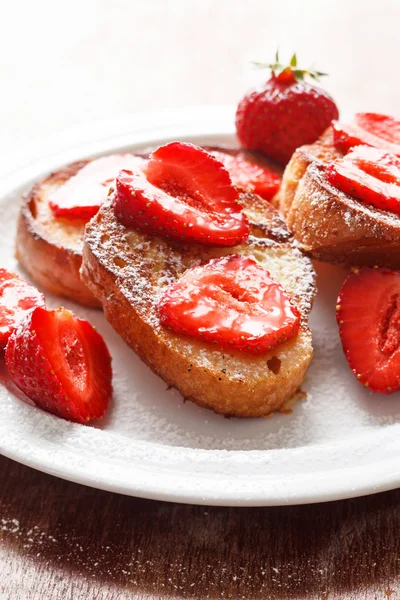 French toasts with powdered sugar and a strawberry — Stock Photo, Image