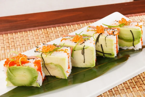 Tasty sushi with avocado — Stock Photo, Image
