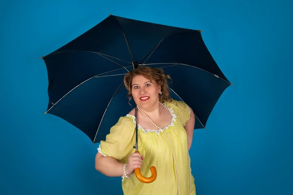 Cute fat woman holding umbrella — Stock Photo, Image