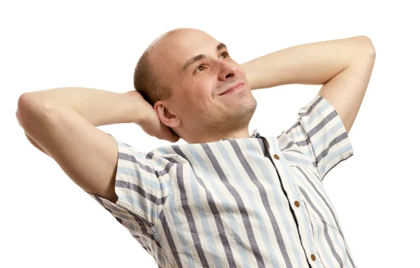 Portrait of handsome man relaxing with hands behind head — Stock Photo, Image