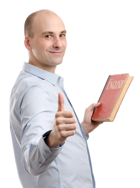 Άνθρωπος που κρατά ένα αγγλικό βιβλίο και παρουσιάζει τον αντίχειρά — Φωτογραφία Αρχείου