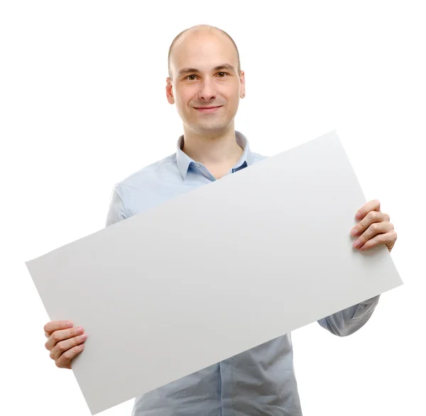 Mutlu gülümseyen genç iş adamı boş tabela gösteriliyor — Stok fotoğraf