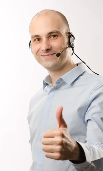 Myynti edustaja mies kuulokkeet — kuvapankkivalokuva