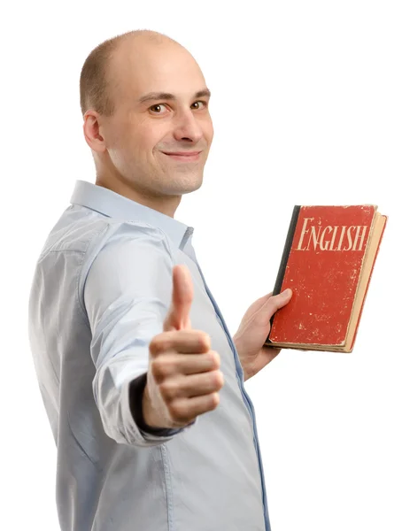 Mladý přátelský člověk s knihou anglický slovník — Stock fotografie