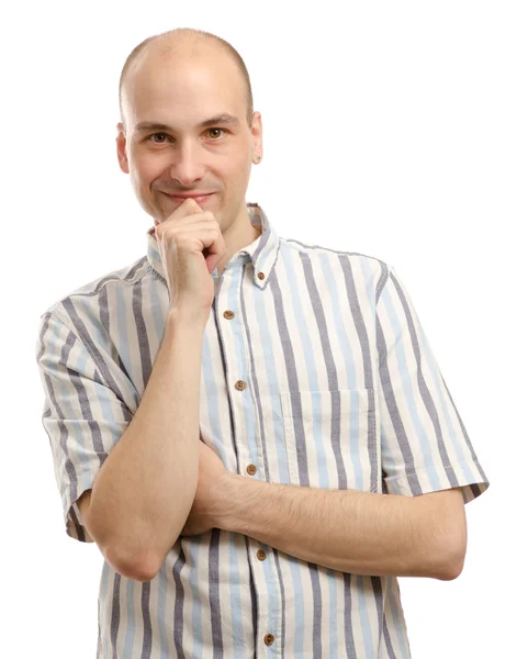 Portret van een jonge man met kin op hand glimlachen — Stockfoto