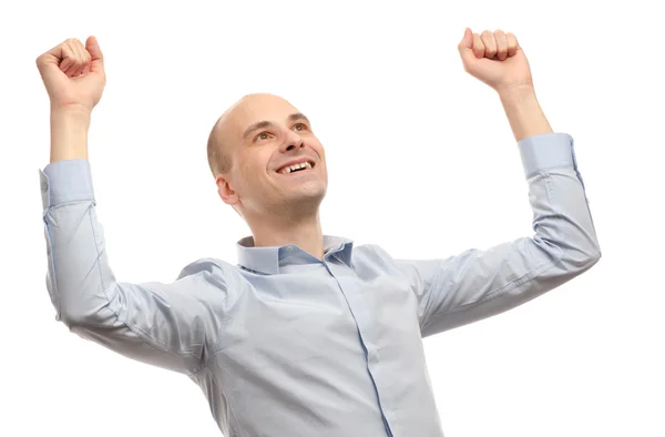 Młody człowiek świętować sukces z podniesiona ręka — Zdjęcie stockowe