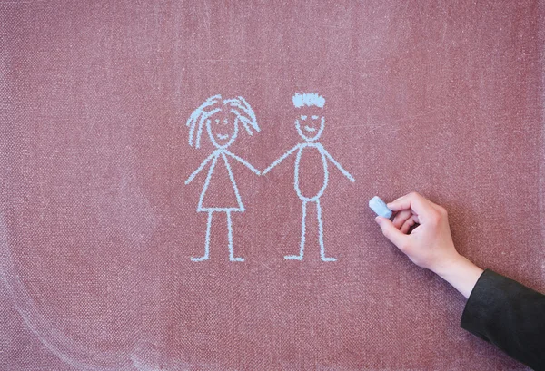 Mężczyzna i kobieta rysowane kredą na tablicy — Zdjęcie stockowe
