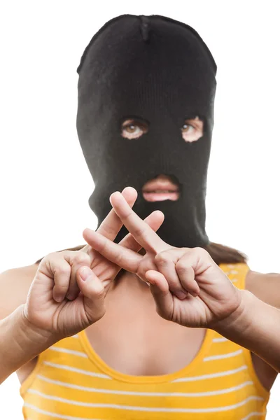 Woman in balaclava showing jail or prison finger gesture — Stock Photo, Image
