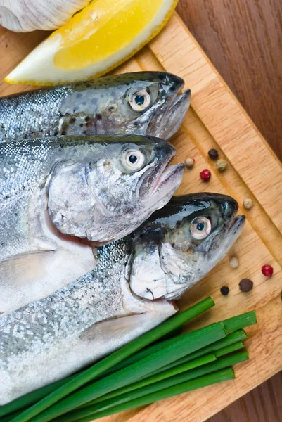 Fresh raw fish trout with lemon — Stock Photo, Image