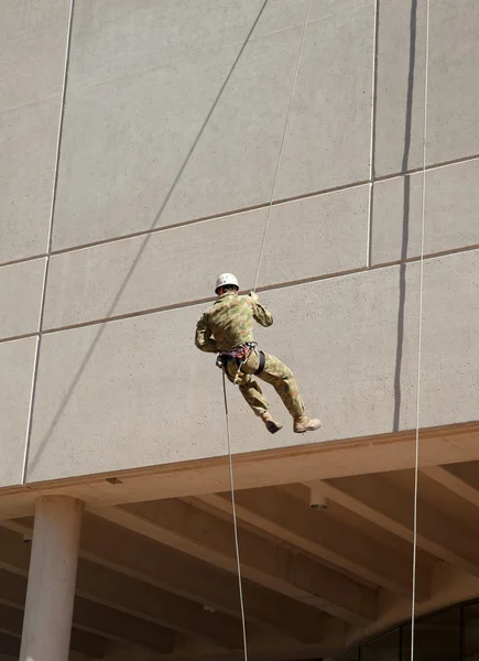 stock image Abseiling down the wall