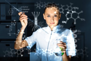 Young chemist working in laboratory clipart