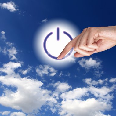 Power button against sky background clipart