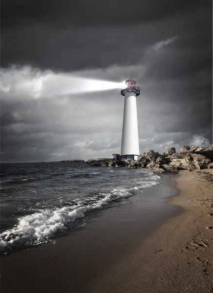 Lighthouse with a beam of light — Stock Photo, Image