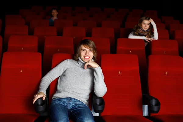 Young man in cinema watching movie — Stock Photo, Image