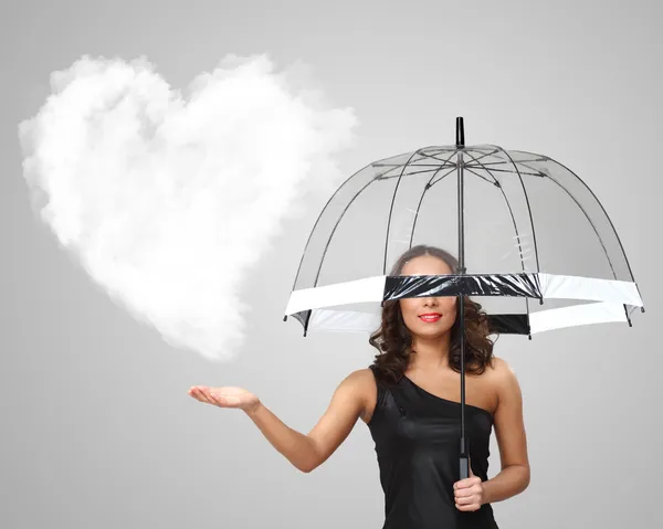 Mujer joven y bonita con paraguas y corazones — Foto de Stock