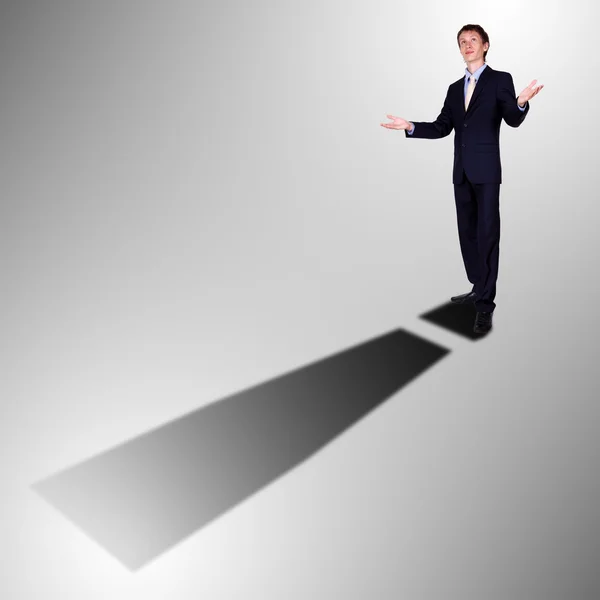 Businessman with shadow as a currency symbol — Stock Photo, Image
