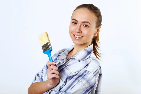 Woman with paint brushes — Stock Photo, Image
