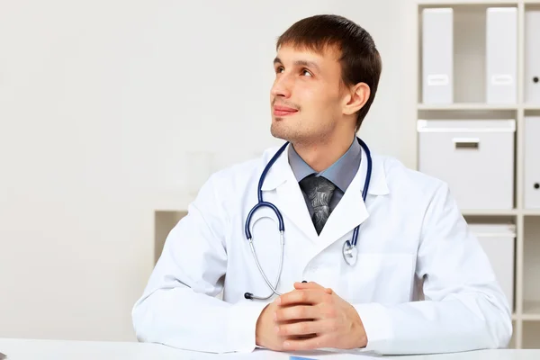 Young male doctor in white uniform — Stock Photo, Image