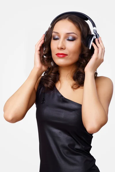 Portrait of young woman with headphones Stock Photo