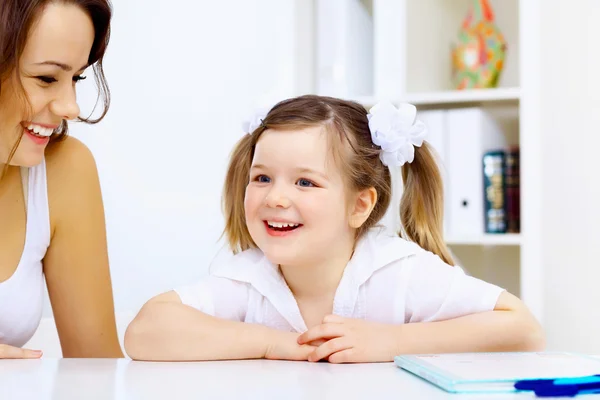 Little girl and her mother studying — Stock Photo, Image