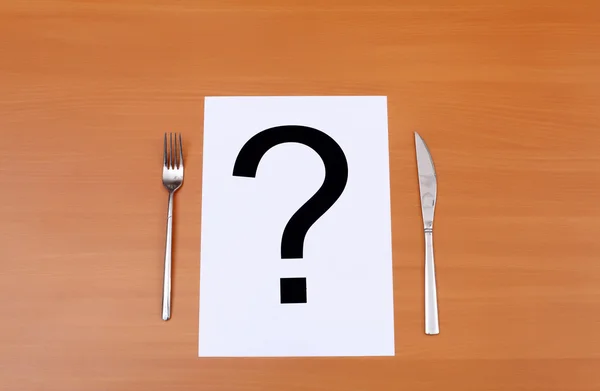 Stock image Metal knife and fork and question mark