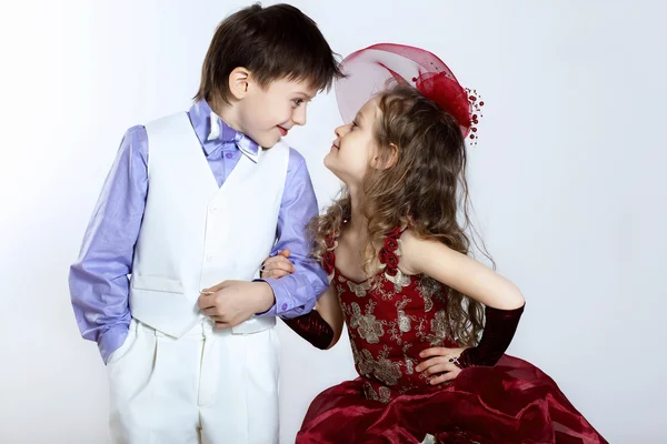 Little girl in beautiful dress and boy — Stock Photo, Image