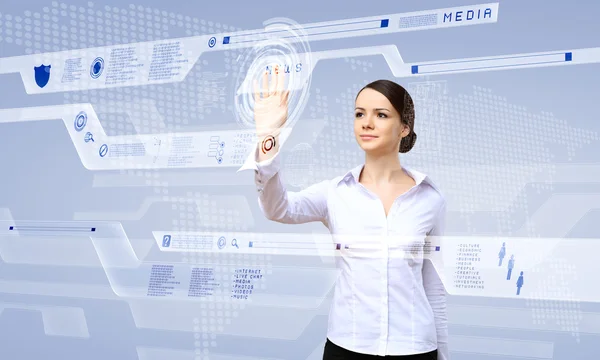 Businesswoman and touch screen technology — Stock Photo, Image