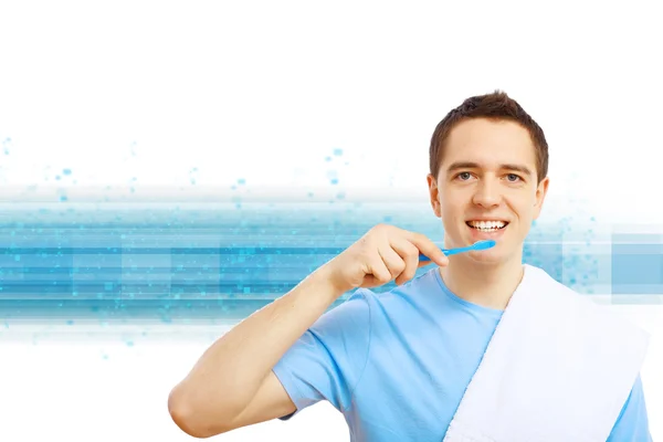 Молодой человек с зубной щеткой — стоковое фото