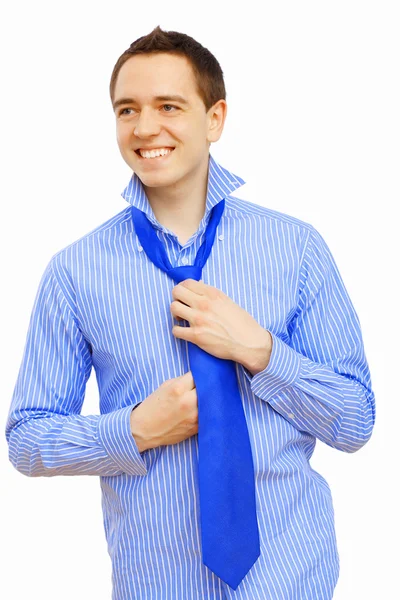 Businessman at home making his tie — Stock Photo, Image
