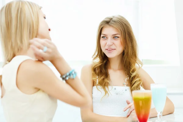 Young woman with a glass of drink — Stock Photo, Image