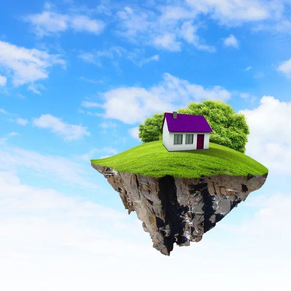 Кусок земли в воздухе с домом и деревом . — стоковое фото