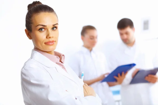 Young female doctor in white uniform — Stock Photo, Image