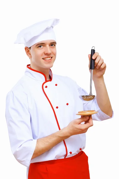 Mladý kuchař připravuje jídlo — Stock fotografie