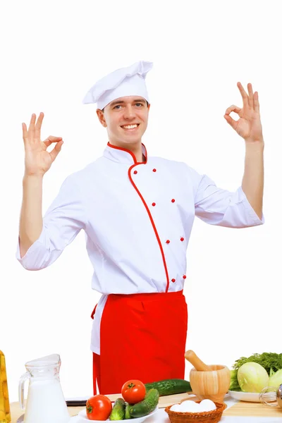 Young cook preparing food Stock Image