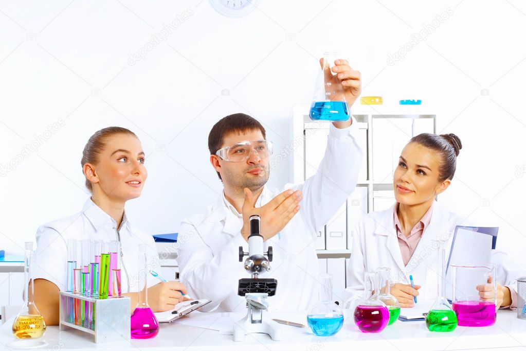 Team of scientists working in laboratory