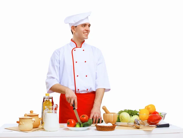Young cook preparing food Royalty Free Stock Images