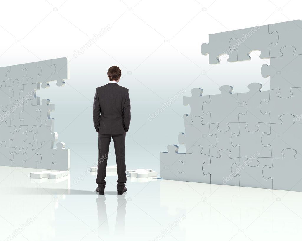 Businessman with a puzzle pieces