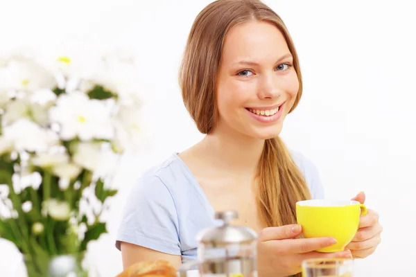 Beautiful young woman drinking tea Royalty Free Stock Images