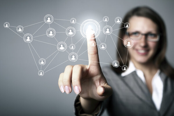 Businesswoman pressing social media icon