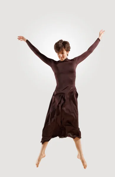 Girl in dark dress dancing — Stock Photo, Image