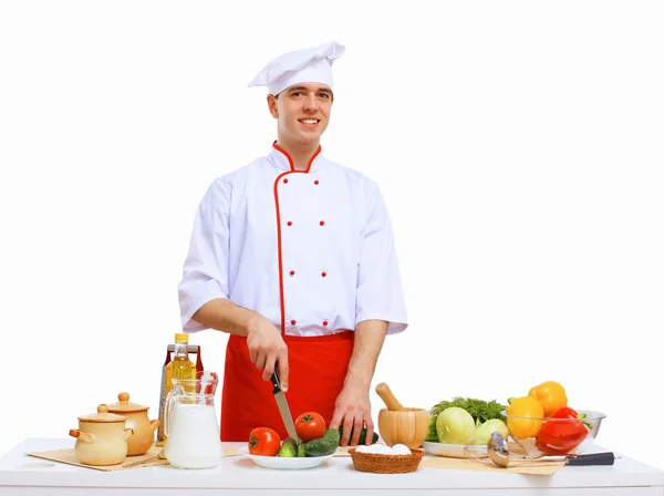 Jovem cozinheiro preparando alimentos — Fotografia de Stock