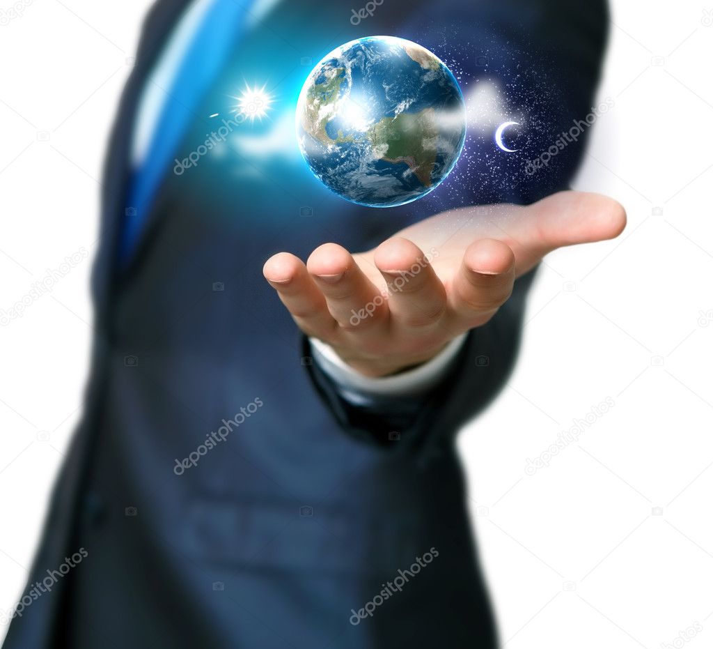 Human hand holding our planet earth