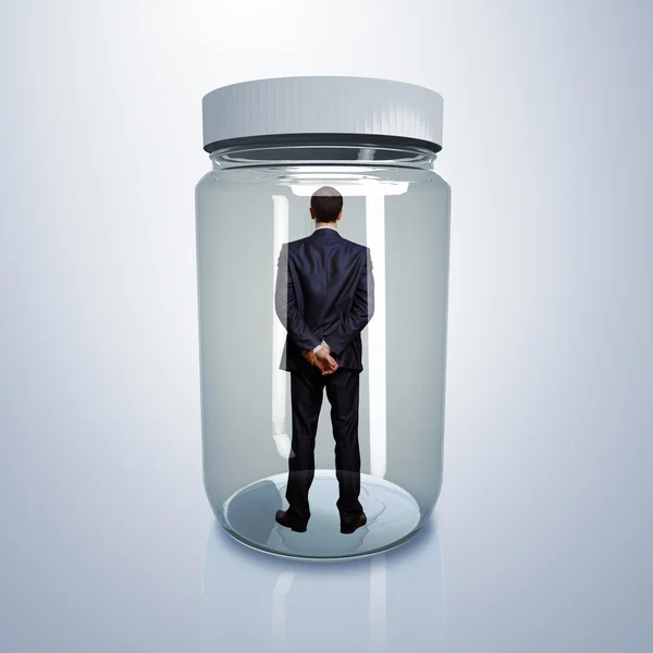 Businessman inside glass jar — Stock Photo, Image